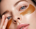 Beautiful fresh girl with cosmetic patches under eyes, perfect skin and natural make-up. Beauty face.